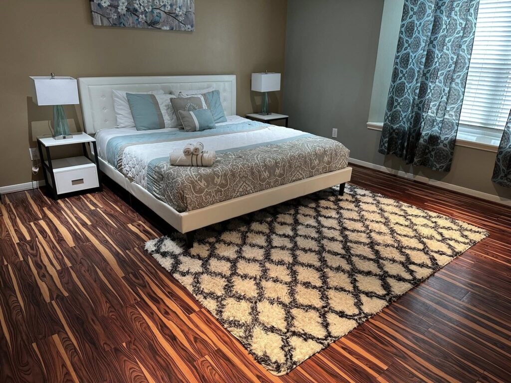 "Freshly made bed with professionally laundered white linens — Airbnb cleaning Las Vegas by Nany Cleaning Services."